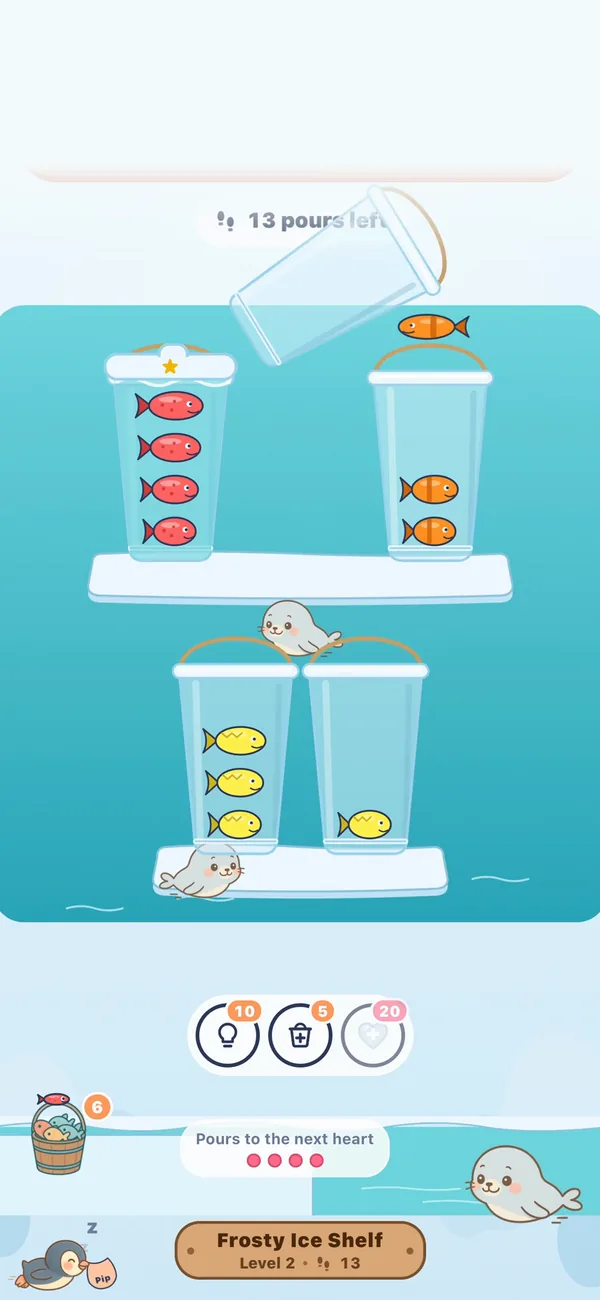 Level 2 of Penguin Lagoon: a pail of red fish tipping into another